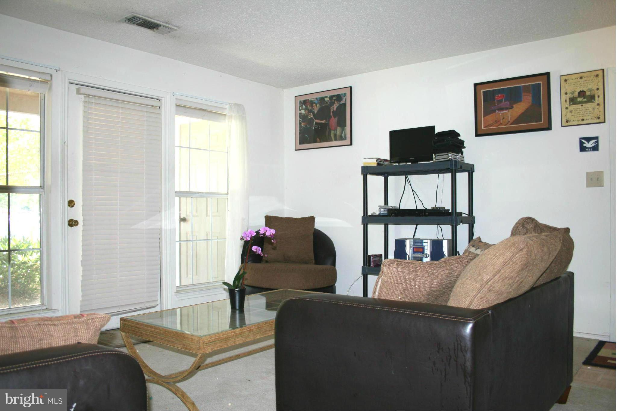20977 Timber Ridge Terrace, Unit 103 Ashburn, VA 20147 - Photo 9 of 12 Living Room 1