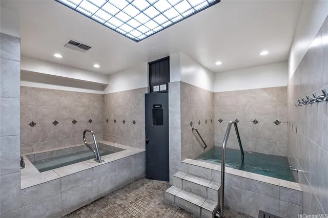 a bathroom with a bathtub and a shower