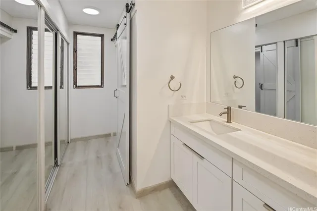 a bathroom with a double vanity sink and mirror