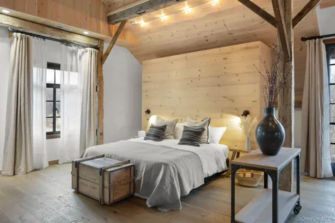 a bedroom with bed and window