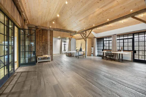 a view of a hall with wooden floor