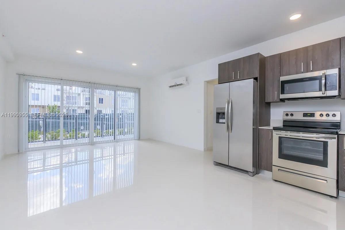 25850 Southwest 140th Court, Unit 6312 Homestead, FL 33032 - Photo 1 of 24 a kitchen with stainless steel appliances a refrigerator and a stove top oven