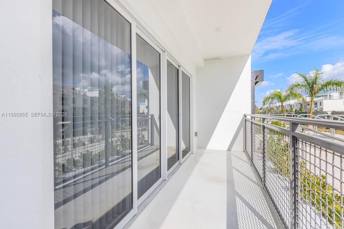 25850 Southwest 140th Court, Unit 6312 Homestead, FL 33032 - Photo 13 of 24 a view of balcony with wooden floor