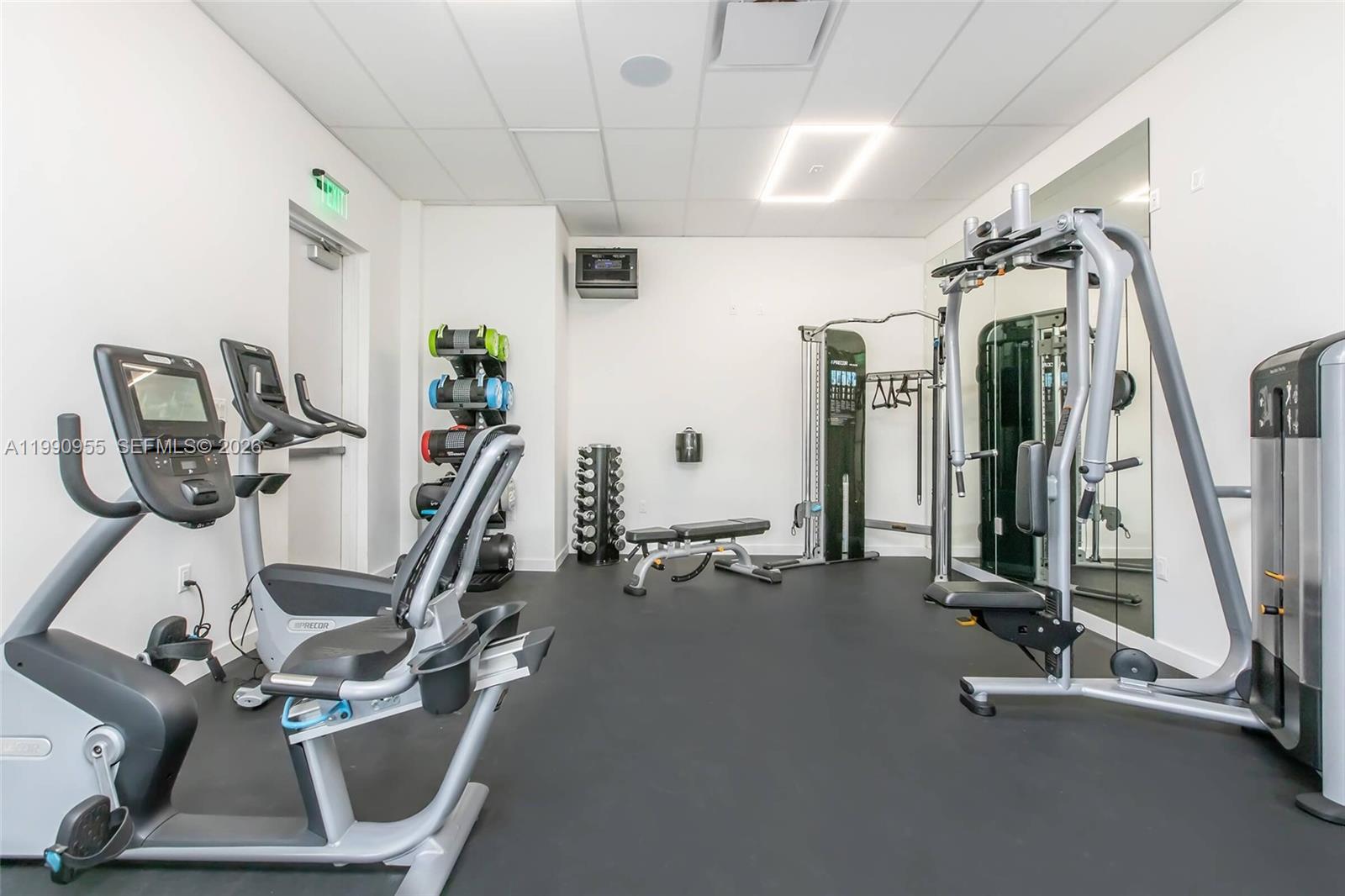 25850 Southwest 140th Court, Unit 6312 Homestead, FL 33032 - Photo 19 of 24 a view of a room with gym equipment