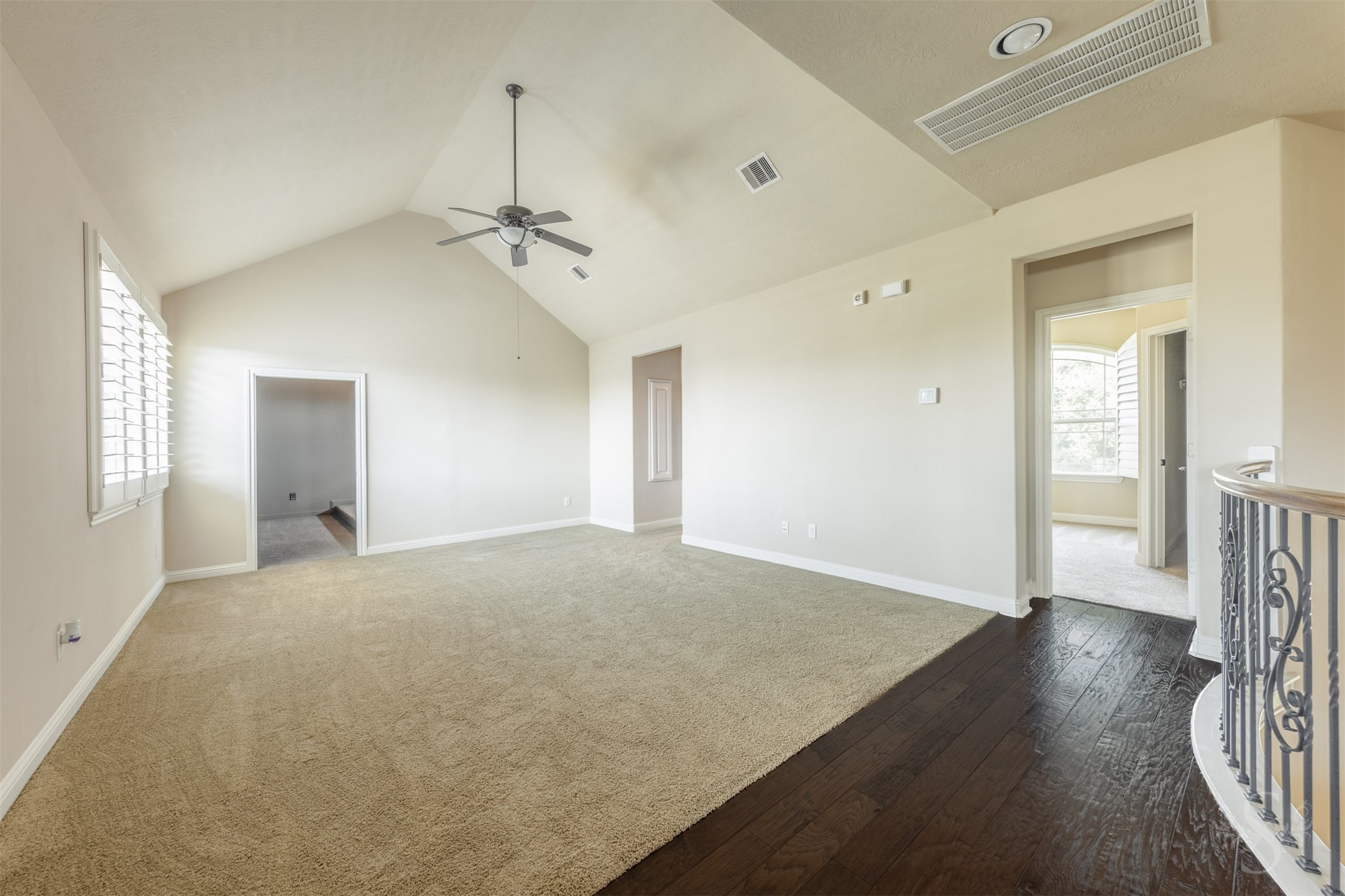 5803 Mustang Ridge Lane Fulshear, TX 77441 - Photo 26 of 48 Upstairs living space features elevated ceilings, wood flooring at the entry and easy access to the secondary bedrooms and media room. Designed with both comfort and versatility in mind, the layout offers endless possibilities for everyday living and entertaining.