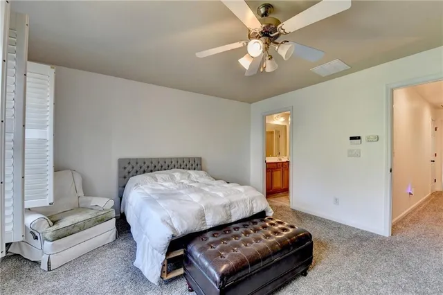 a bedroom with furniture and a chandelier