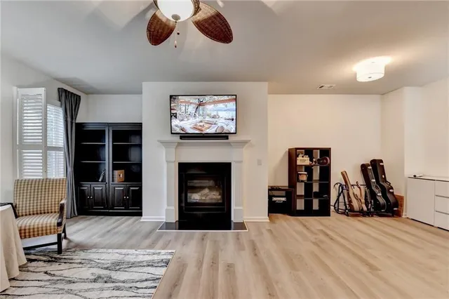 a view of a livingroom with furniture and a fireplace