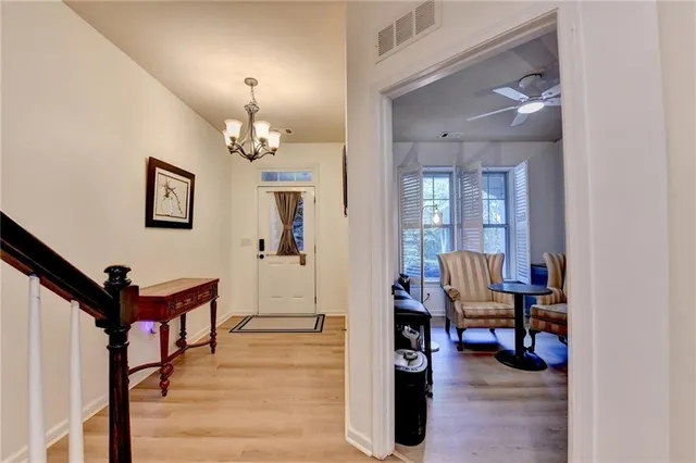 a view of a livingroom with furniture and hardwood floor
