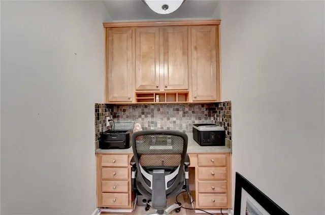 a kitchen with a stove and a microwave