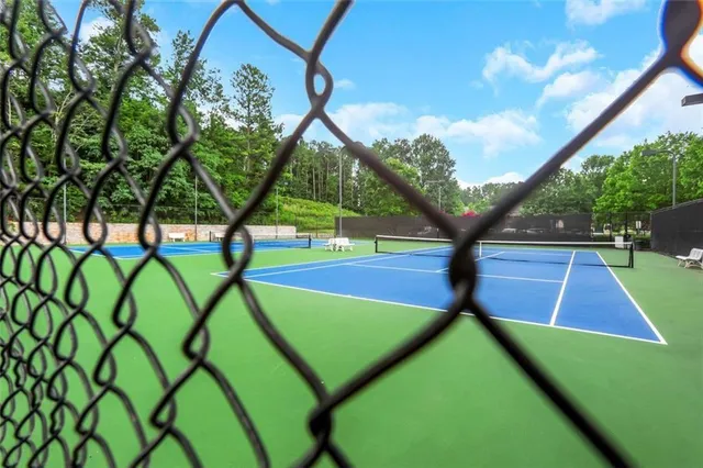 a view of an outdoor space and basketball court