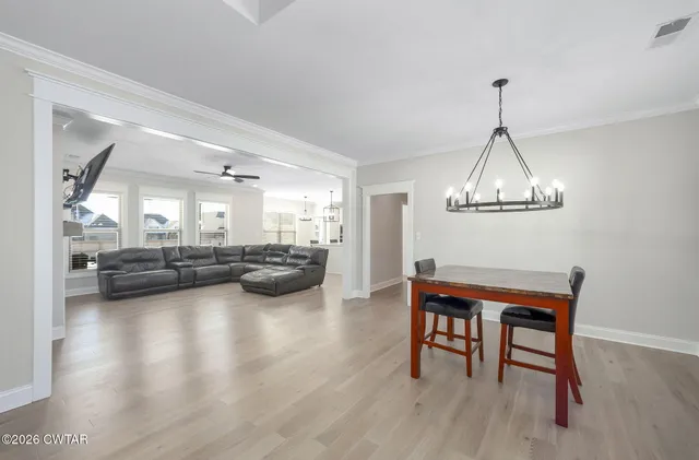 a room with furniture and a wooden floor