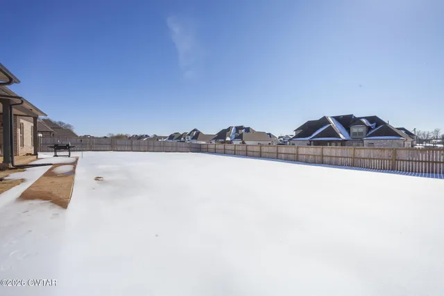 a view of swimming pool with outdoor seating and city view