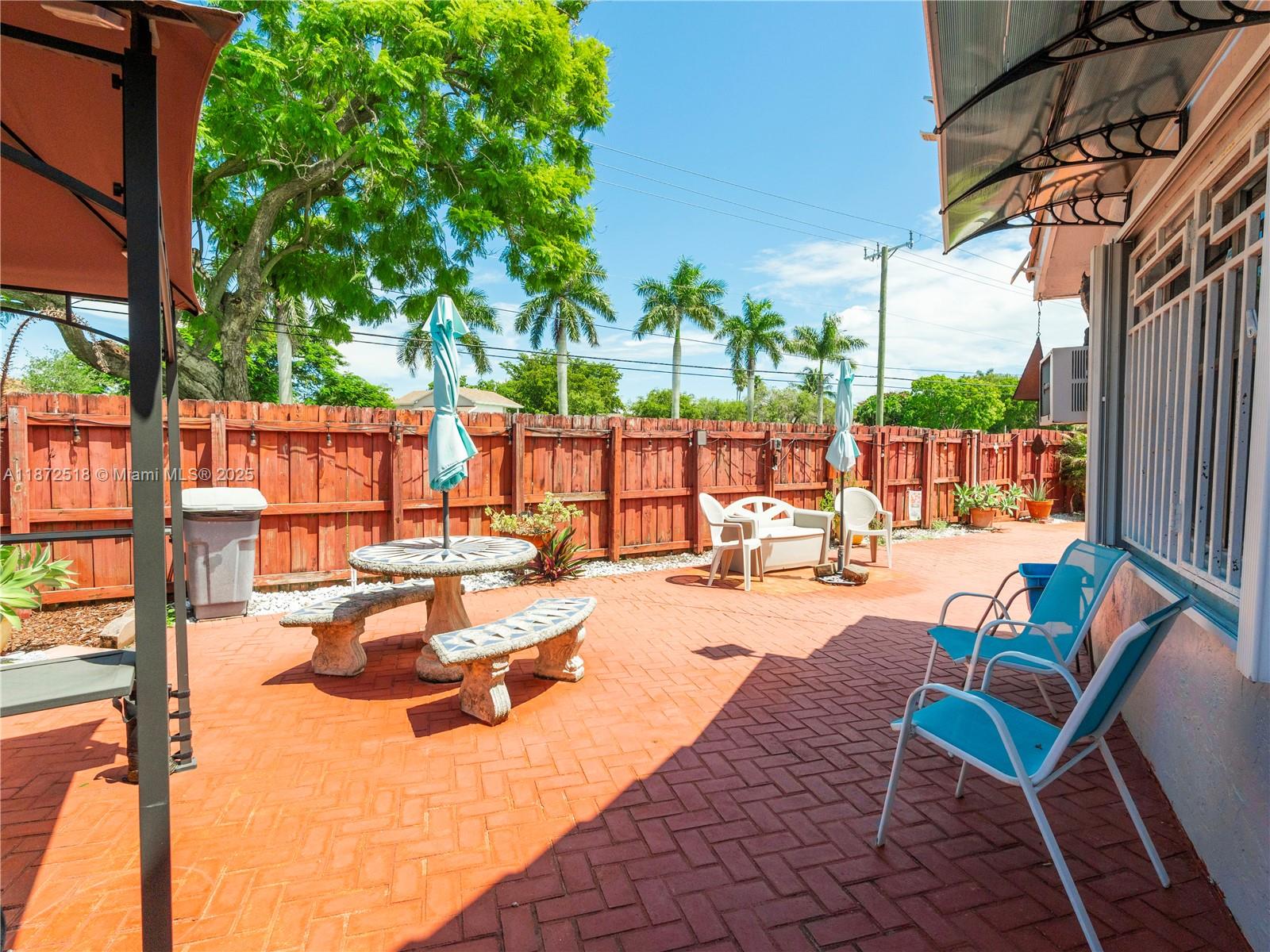 15275 Southwest 56th Terrace Miami, FL 33193 - Photo 25 of 32 a view of swimming pool with outdoor seating and lounge chairs