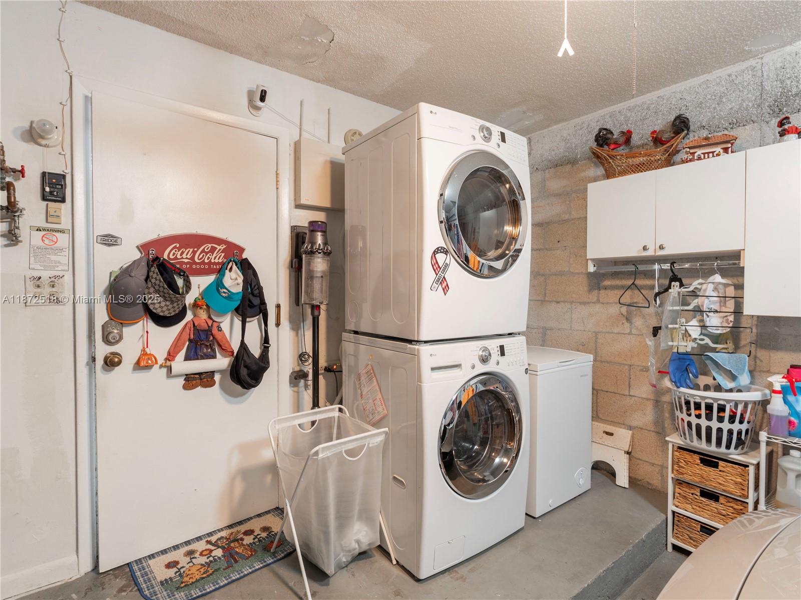 15275 Southwest 56th Terrace Miami, FL 33193 - Photo 27 of 32 a view of livingroom with washer and dryer