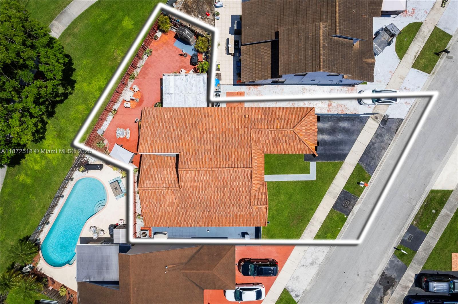 15275 Southwest 56th Terrace Miami, FL 33193 - Photo 32 of 32 an aerial view of a house with a garden and swimming pool
