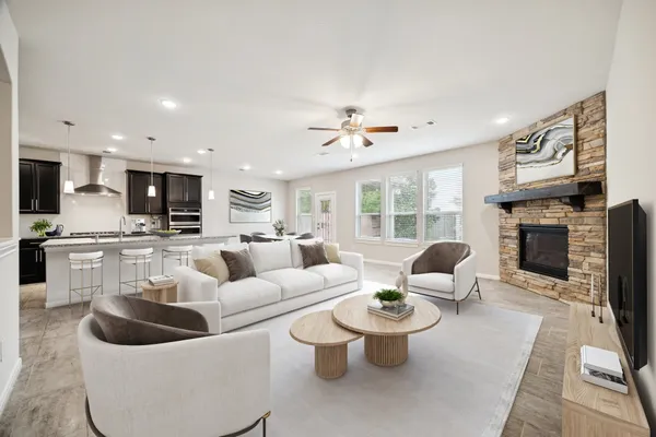 a living room with furniture and a fireplace