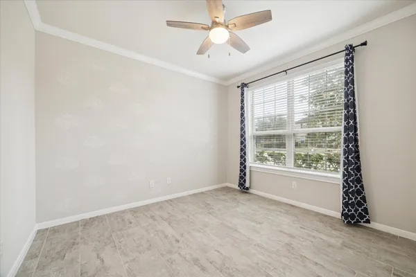 a view of an empty room with a window