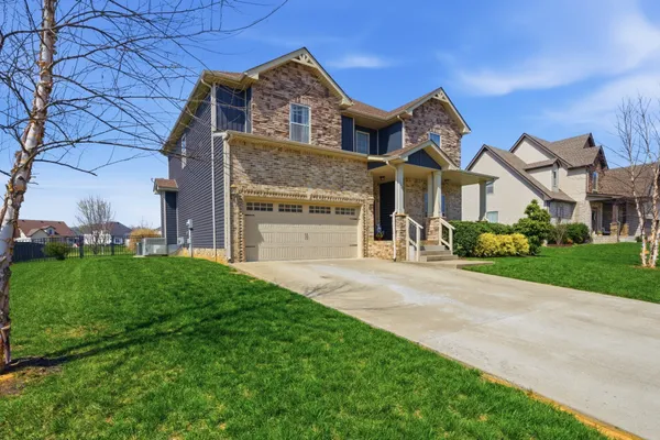 front view of a house with a yard