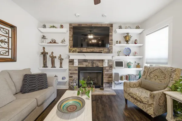 a living room with furniture and a fireplace