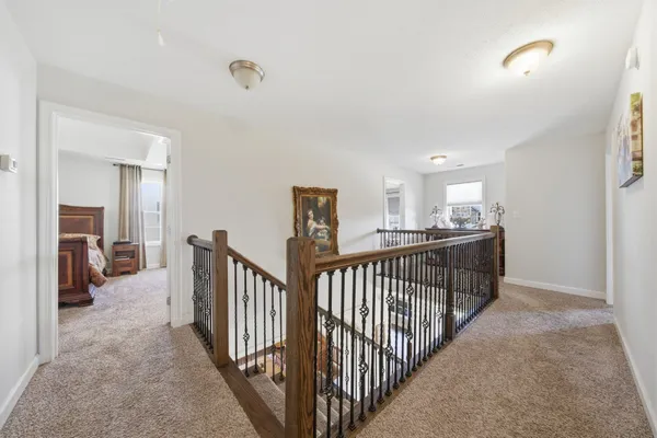 a view of a hallway with livingroom
