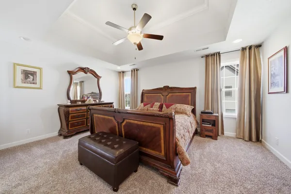 a bedroom with a bed furniture and a window