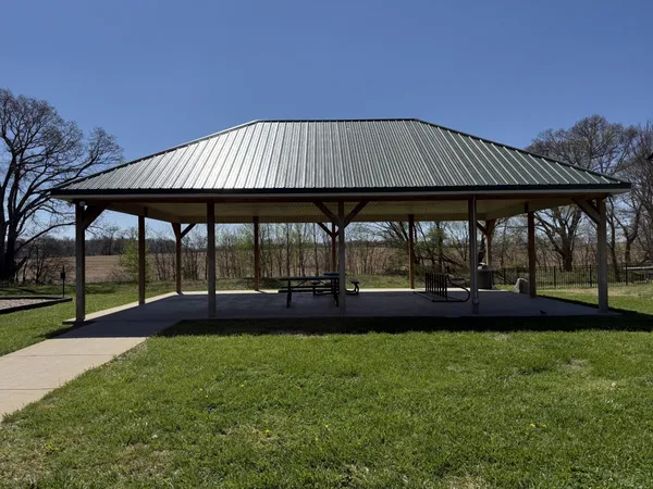 a view of swimming pool with outdoor seating