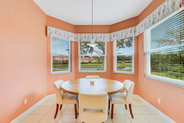 a dining room with furniture and window
