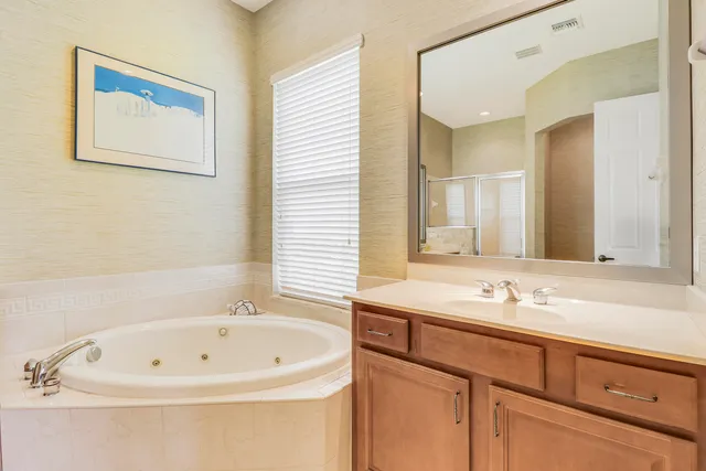 a bathroom with a bathtub and a sink