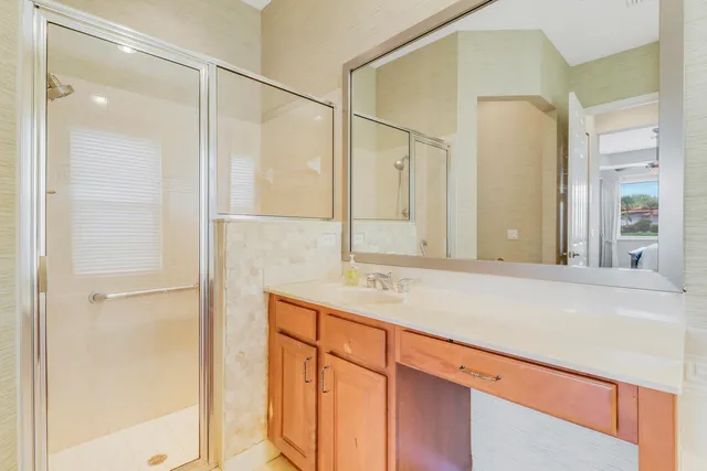 a bathroom with a shower and a sink