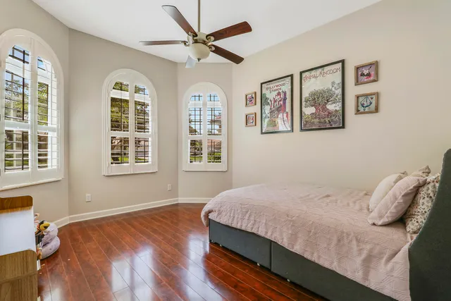 a bedroom with a large bed and a window
