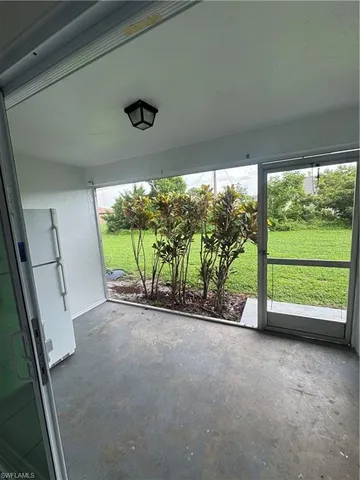 a view of a room with a large window