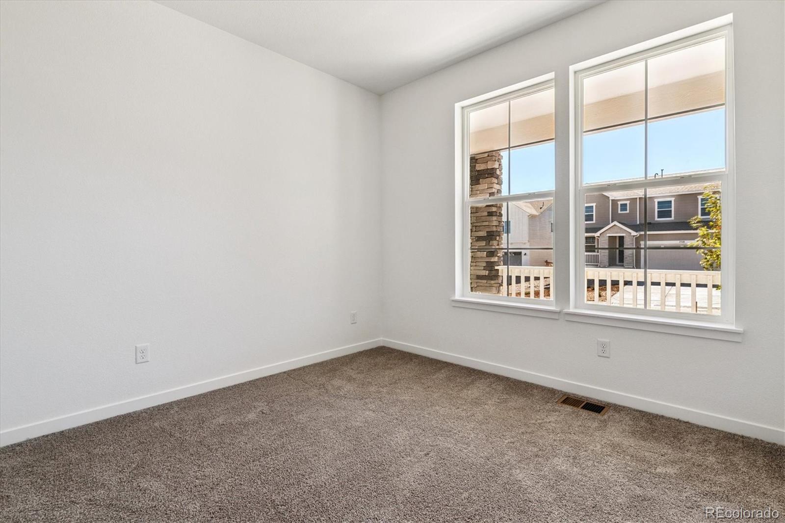 741 Lawson Drive Elizabeth, CO 80107 - Photo 4 of 27 an empty room with a window