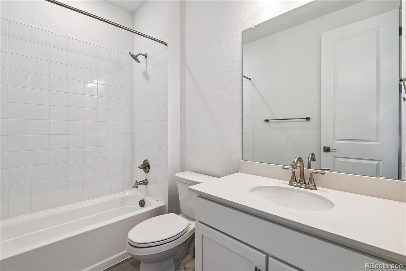 741 Lawson Drive Elizabeth, CO 80107 - Photo 5 of 27 a bathroom with a sink toilet and shower