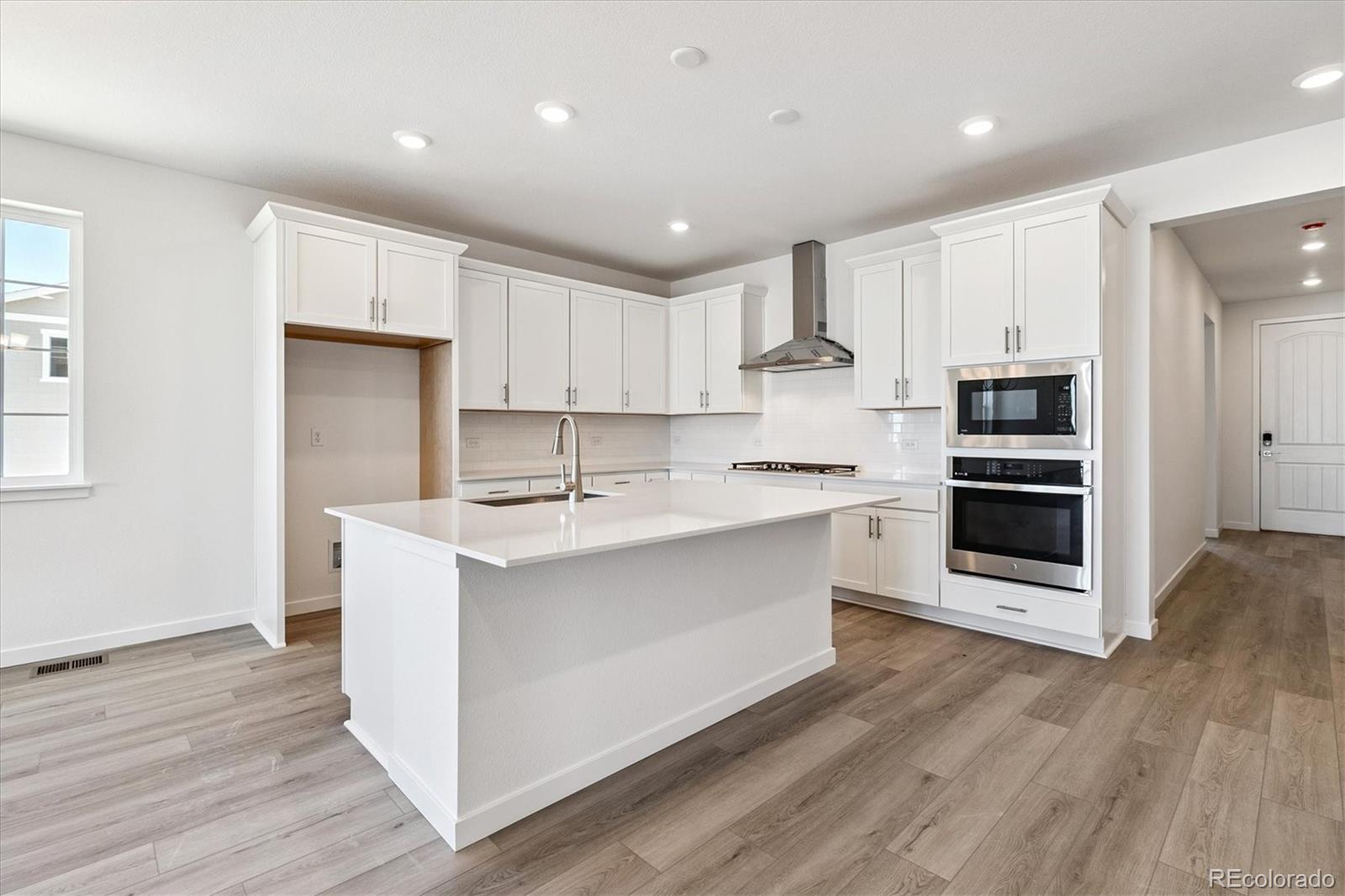 741 Lawson Drive Elizabeth, CO 80107 - Photo 8 of 27 a kitchen with a sink stainless steel appliances and cabinets