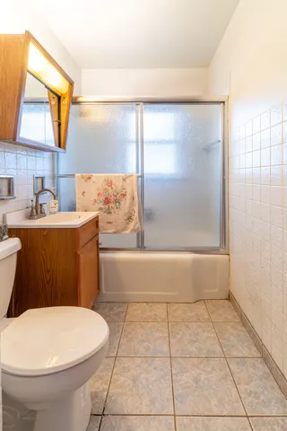 a view of a kitchen with a refrigerator