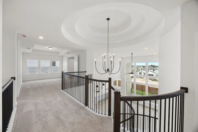 a view of hallway with wooden floor