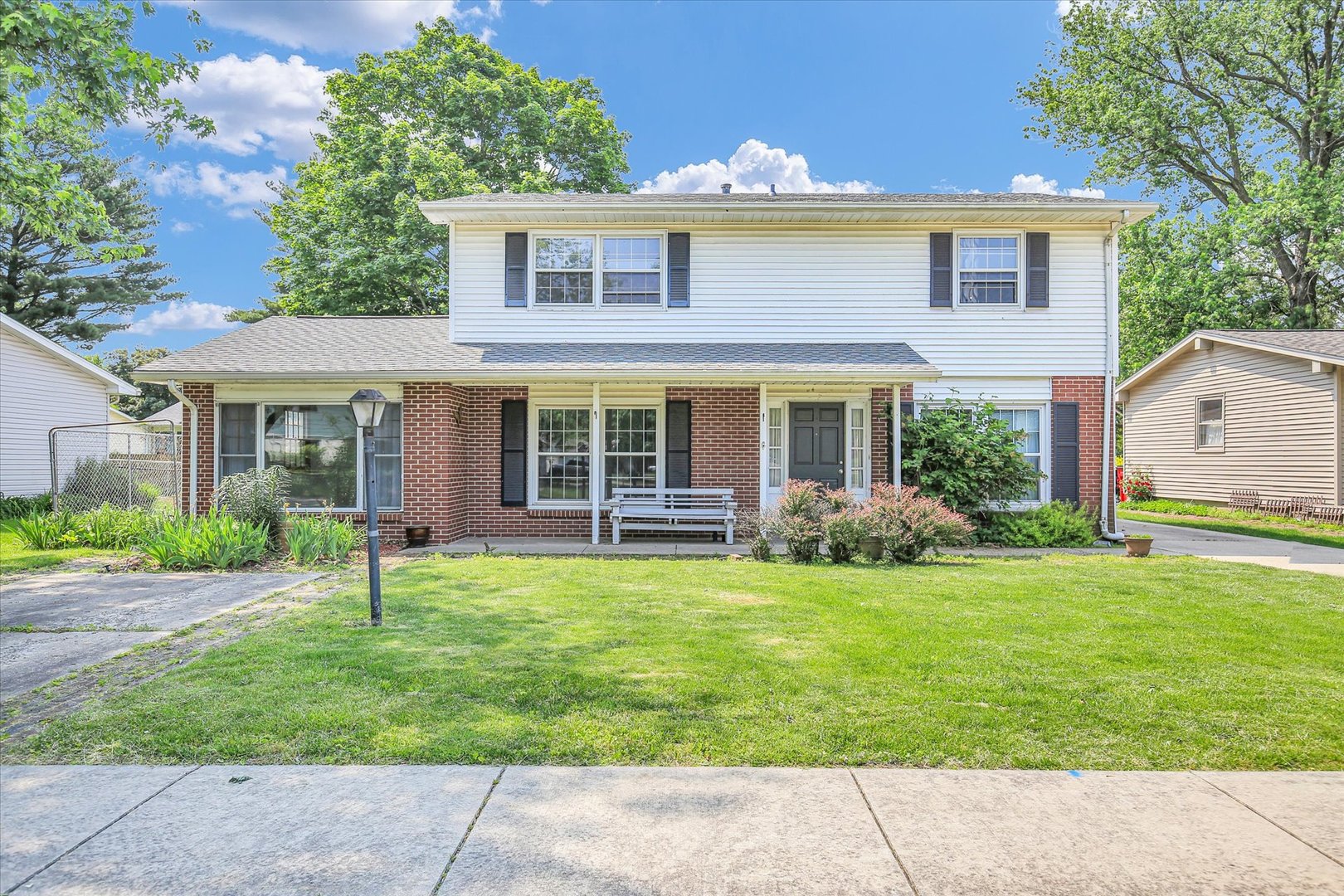 2107 Barberry Drive Champaign, IL 61821 - Photo 1 of 37 a view of a house with a yard and a garden
