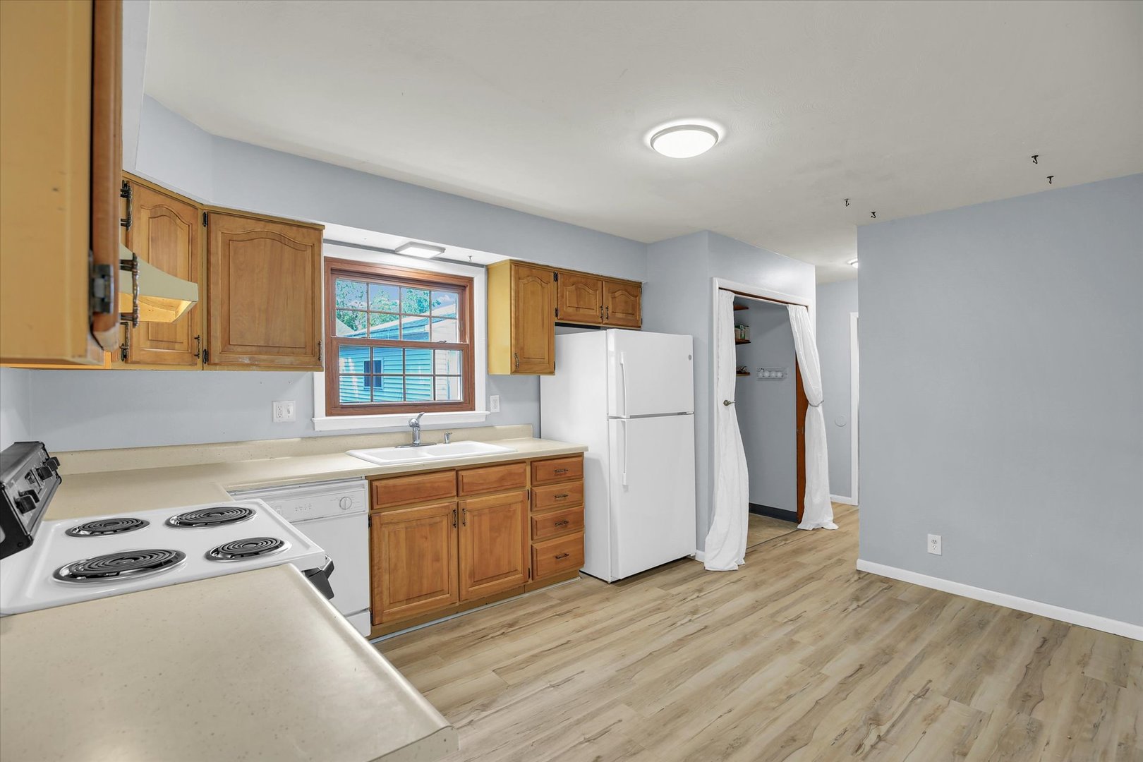 2107 Barberry Drive Champaign, IL 61821 - Photo 15 of 37 a kitchen with a refrigerator a sink and wooden floor