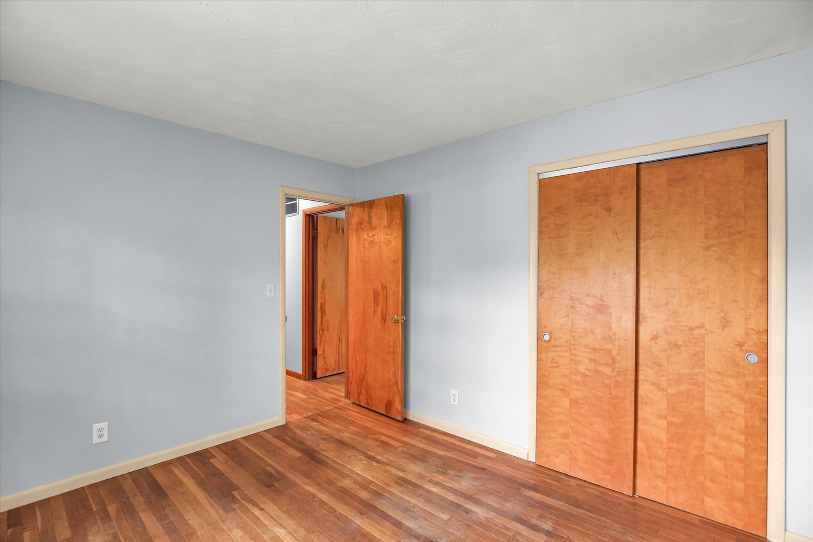 2107 Barberry Drive Champaign, IL 61821 - Photo 22 of 37 a view of an empty room with wooden floor and a window