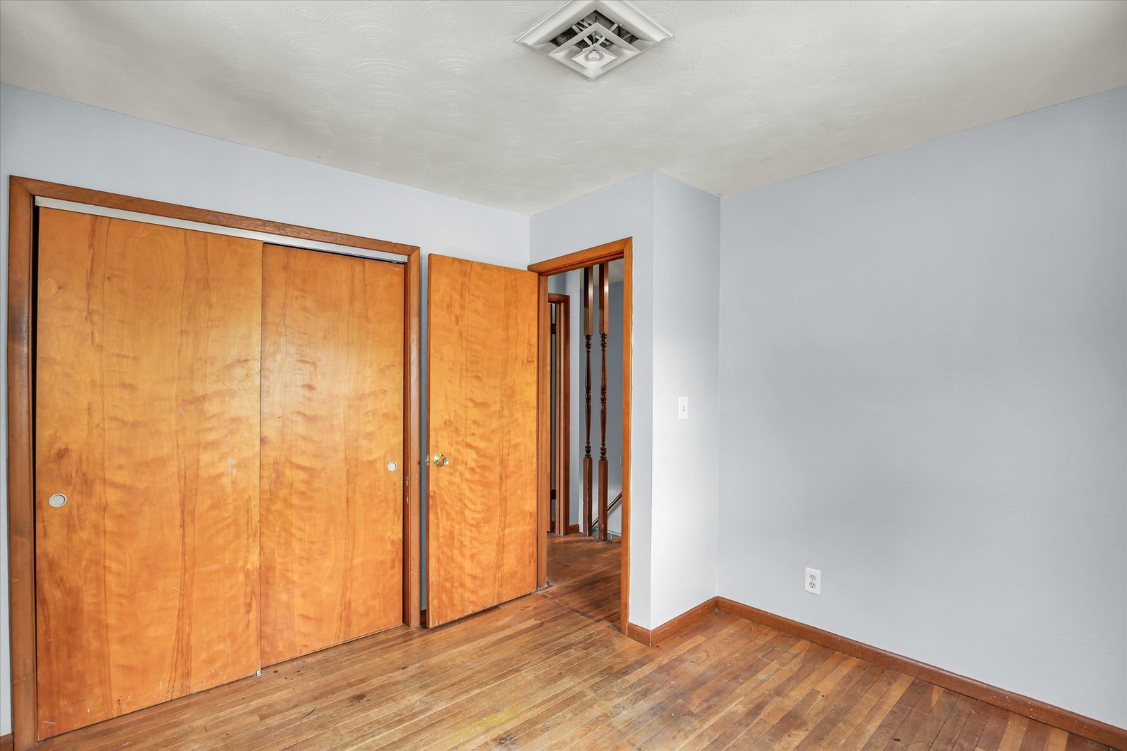 2107 Barberry Drive Champaign, IL 61821 - Photo 24 of 37 an empty room with wooden floor and windows