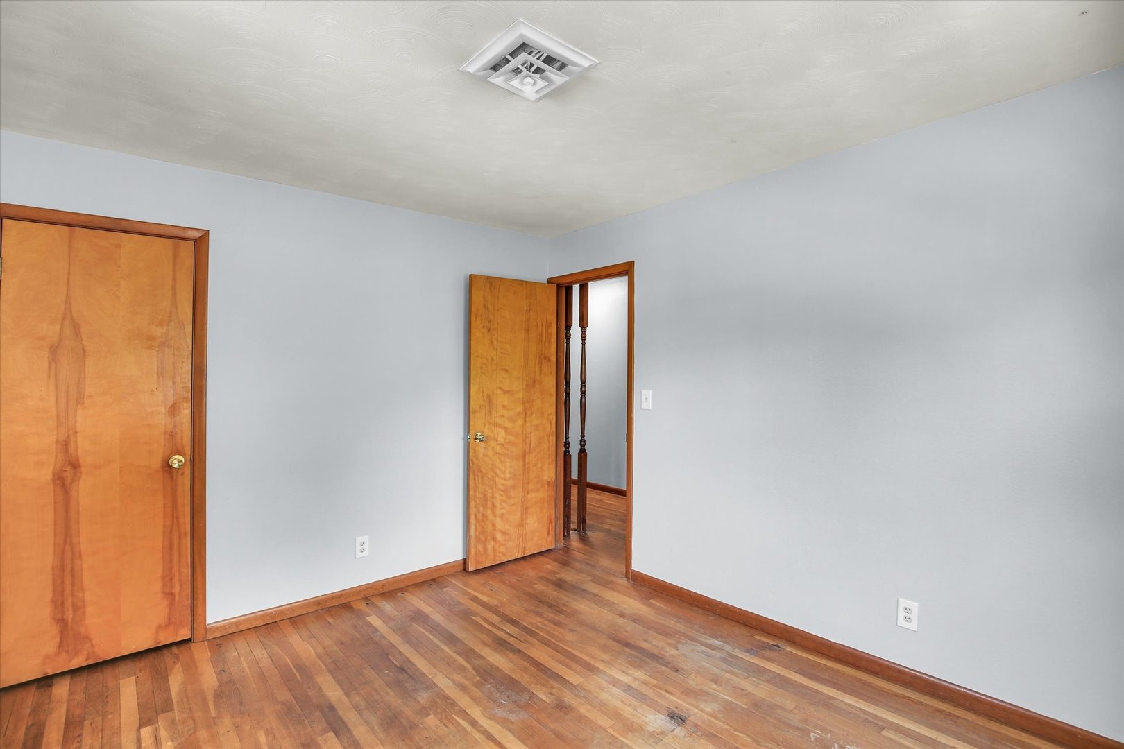 2107 Barberry Drive Champaign, IL 61821 - Photo 26 of 37 an empty room with wooden floor and a window