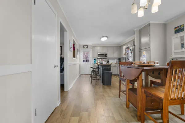 a view of a dining room with furniture and a livingroom