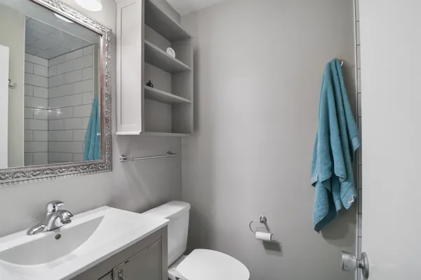 a bathroom with a sink and toilet