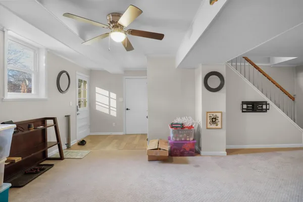 a view of room with workspace and windows