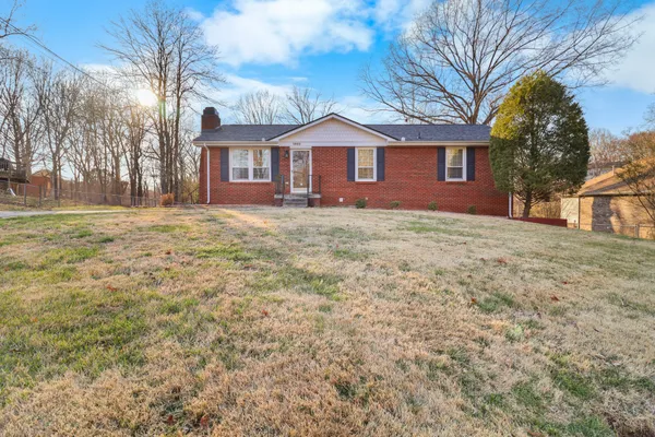 a front view of a house with yard