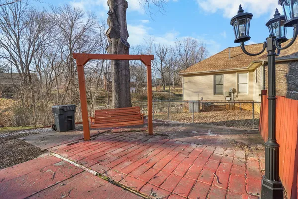 a view of a pathway with a backyard