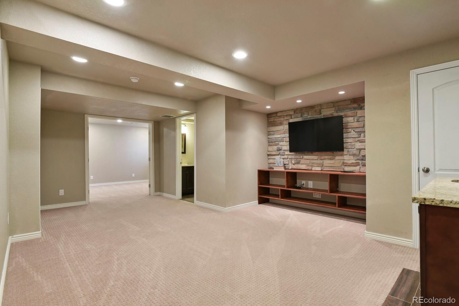 3495 Amber Sun Circle Castle Rock, CO 80108 - Photo 21 of 29 a living room with flat screen tv
