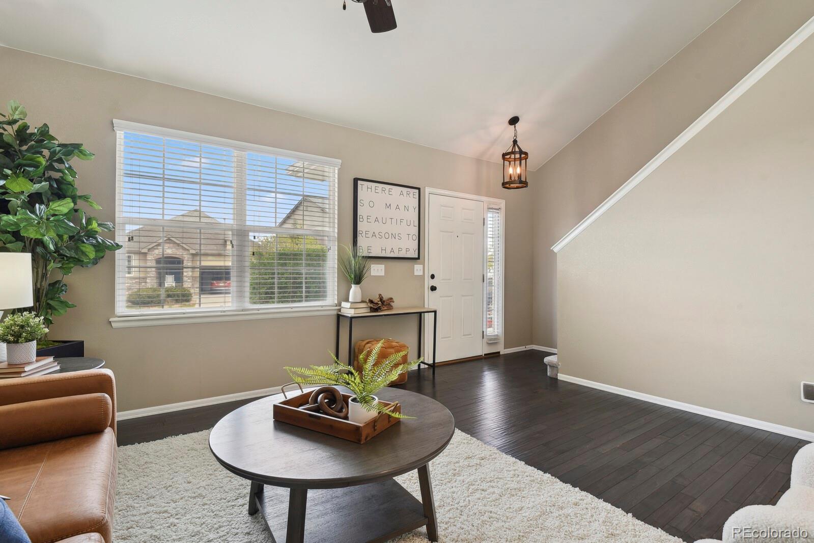 3495 Amber Sun Circle Castle Rock, CO 80108 - Photo 4 of 29 a living room with furniture and a window