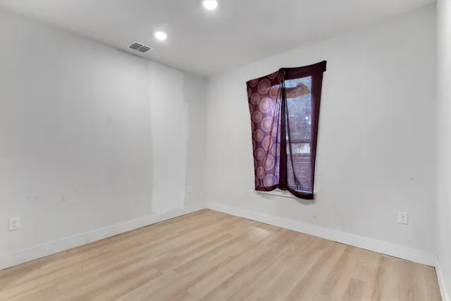 an empty room with window