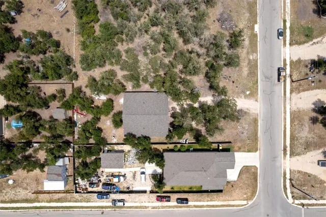 an aerial view of a house with outdoor space